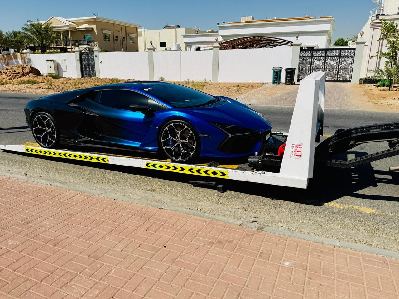 Full box car recovery Dubai - Lamborghini Revuelto on full-lift flatbed
